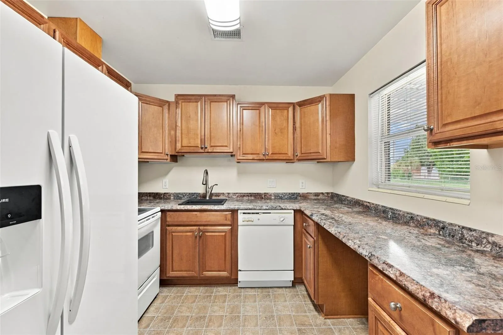Kitchen (Window looks out over backyard.)