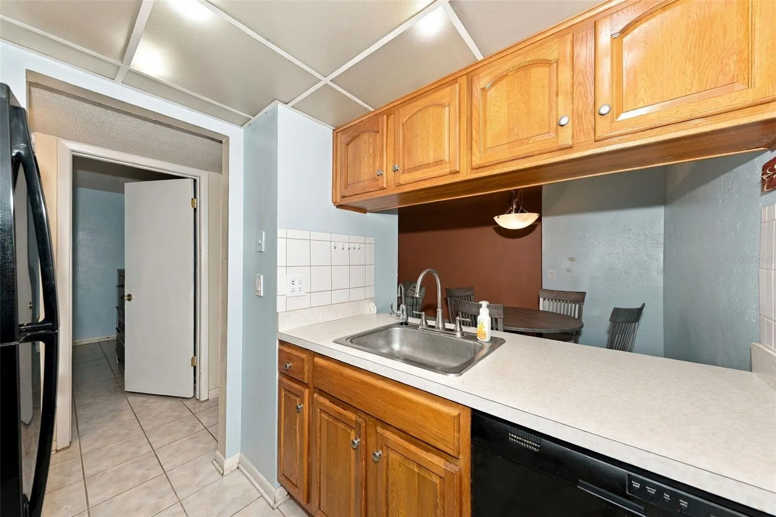 kitchen opens to dining room