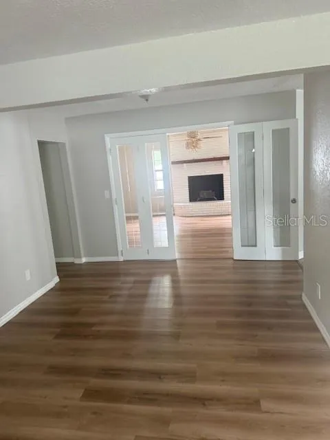 French Doors enteringFamily Room with Fireplace