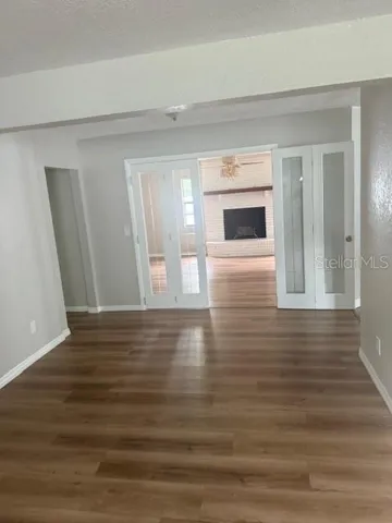 French Doors enteringFamily Room with Fireplace