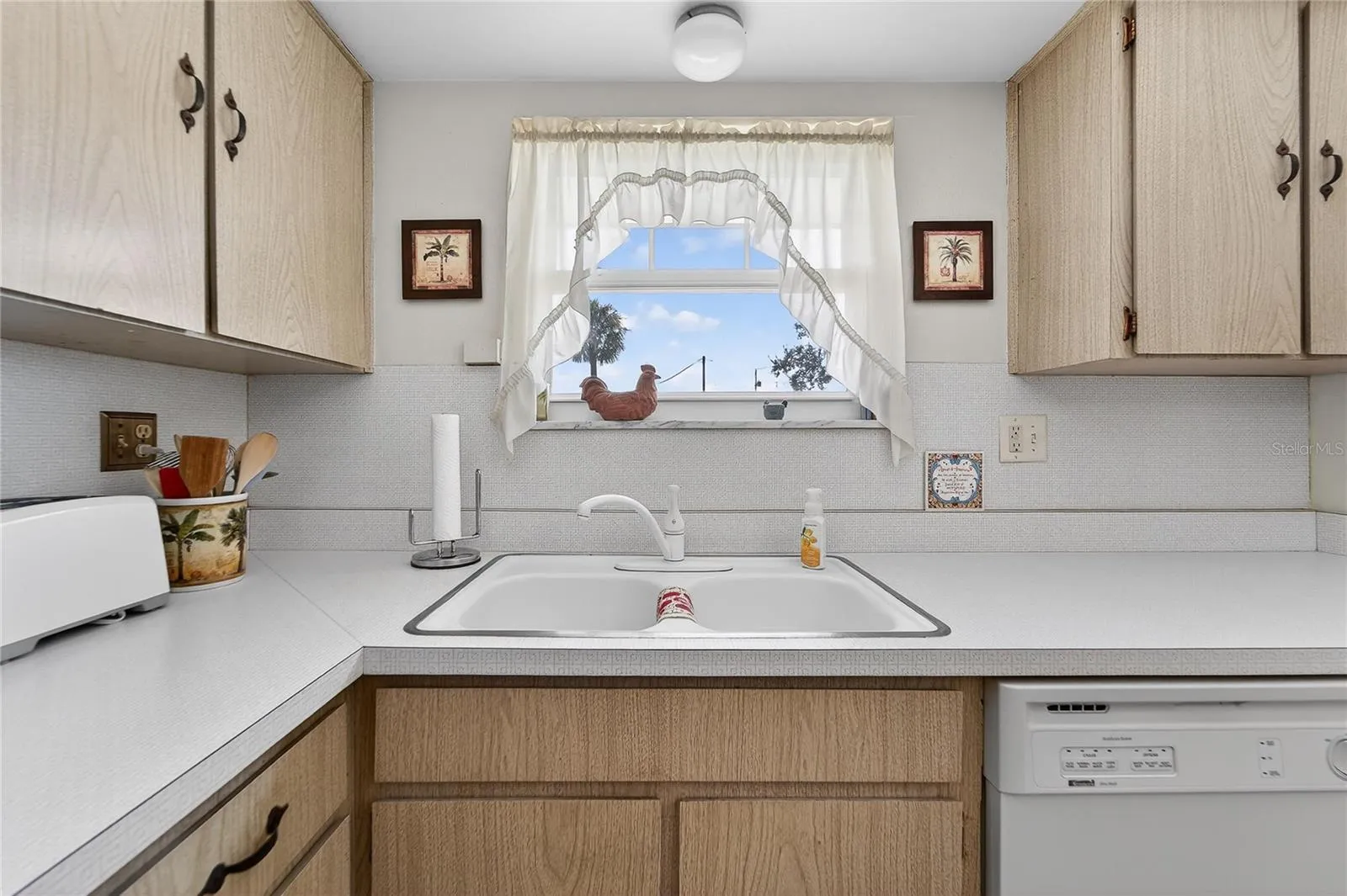 TB8552164 - window over sink looks out to street