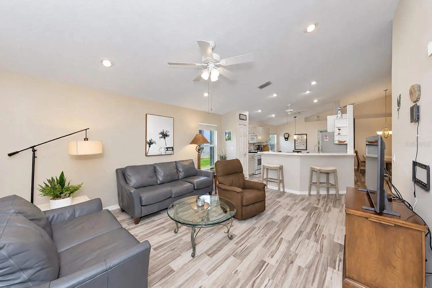 Family room open to kitchen and kitchen cafe.