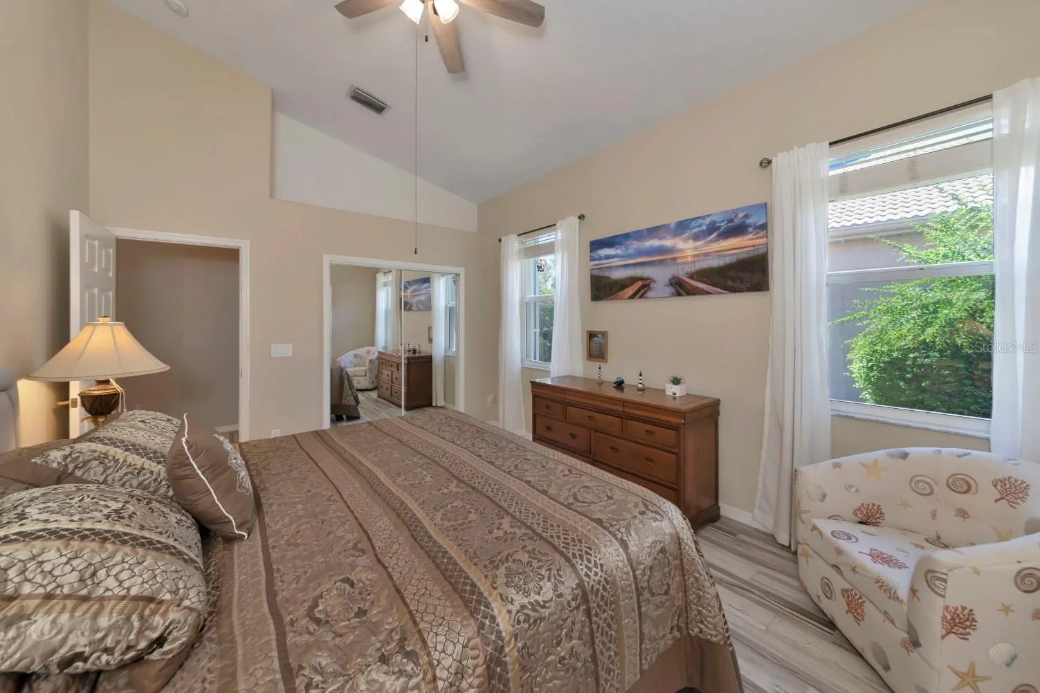 Primary suite, vaulted ceiling, &amp; w/walk-in closet.