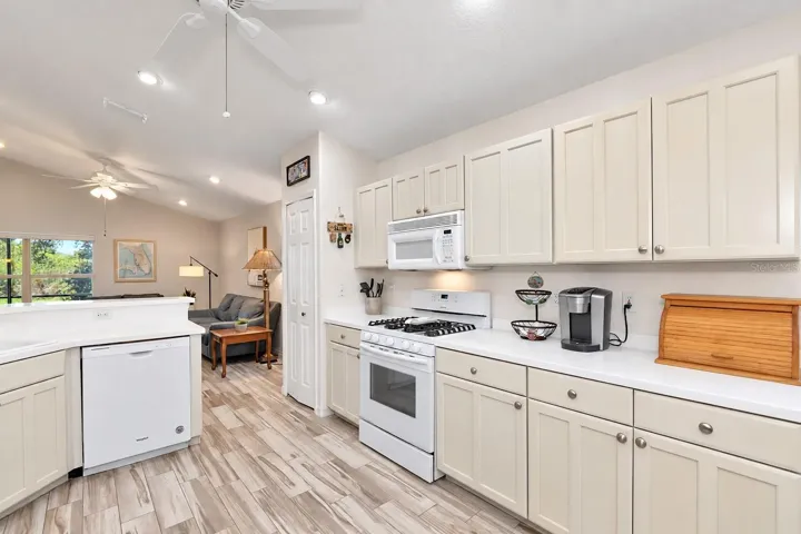 Natural gas range, hood microwave vents outside.