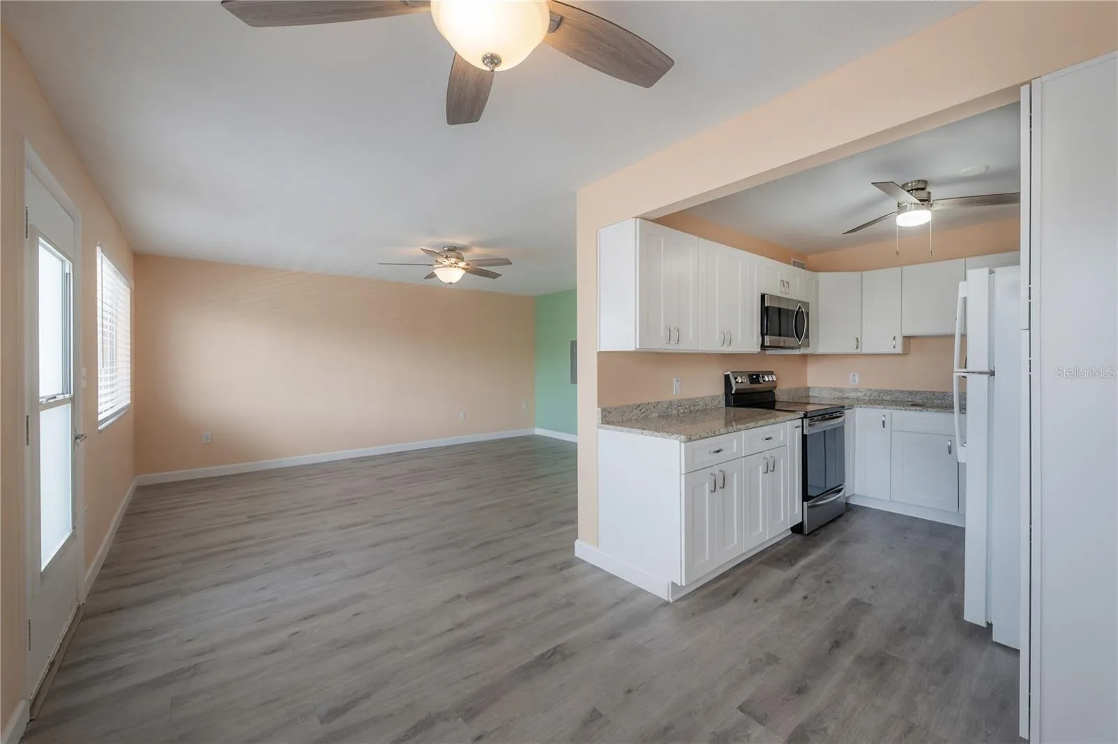 Dining area facing living area and kitchen