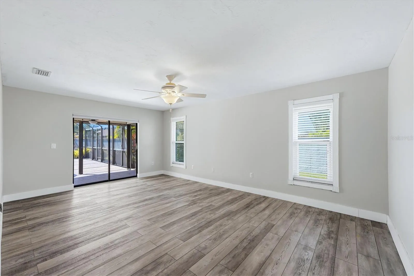 PRIMARY BEDROOM FACING POOL
