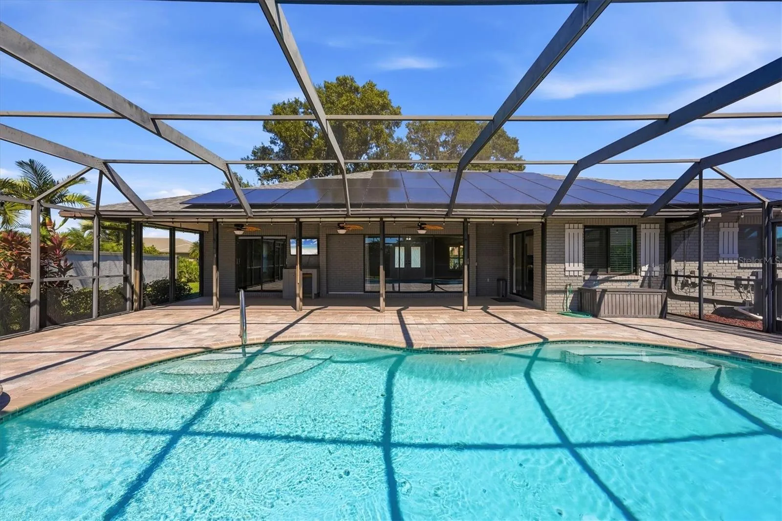 POOL VIEW SHOWING PRIVACY WALL