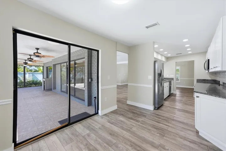 KITCHEN DINING AREA FACING POOL