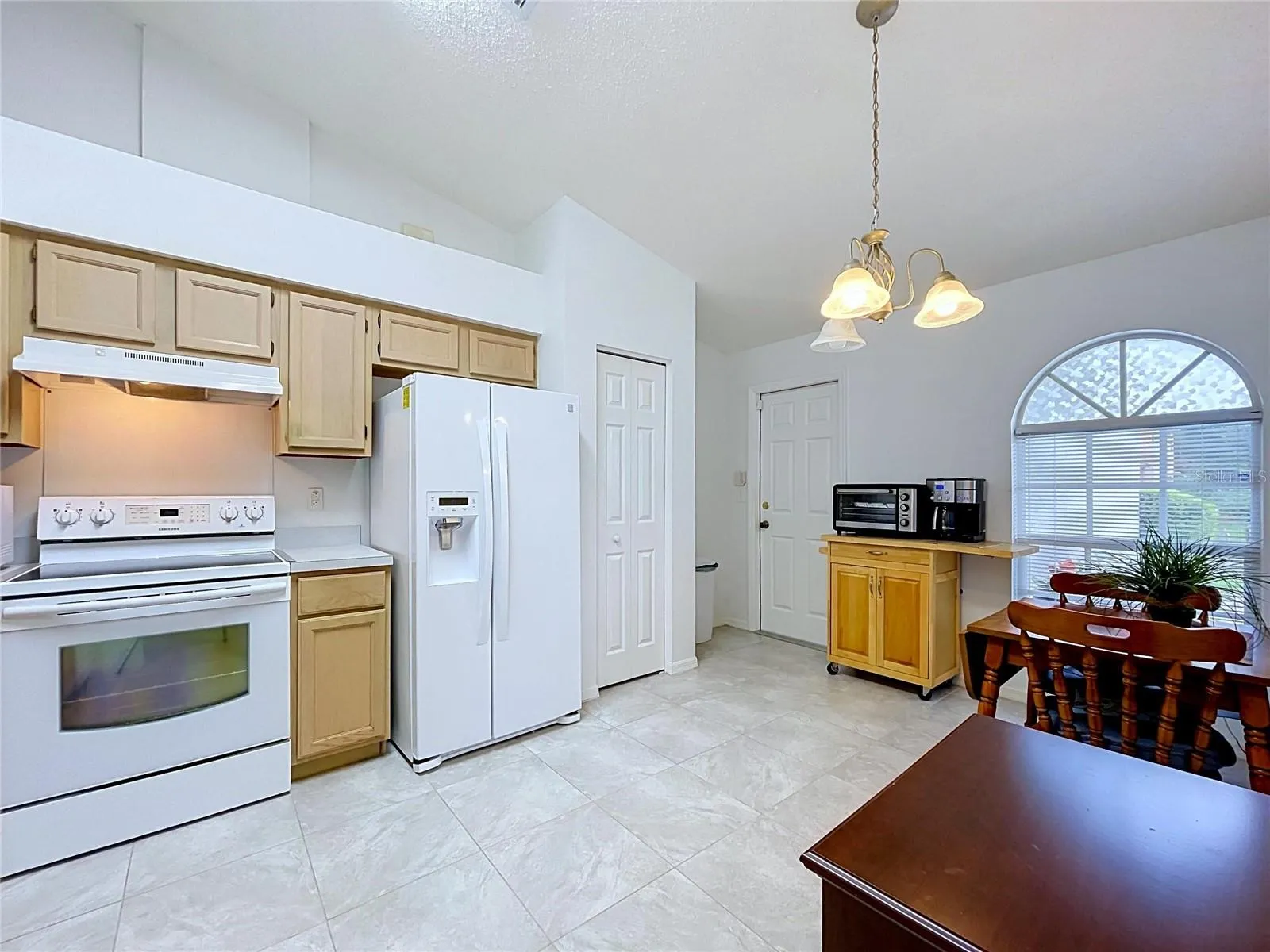 Built-in pantry is by refrigerator