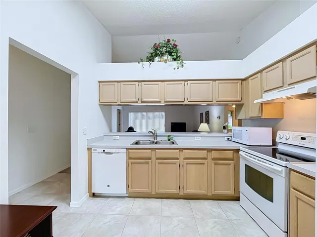 Kitchen is off of the foyer