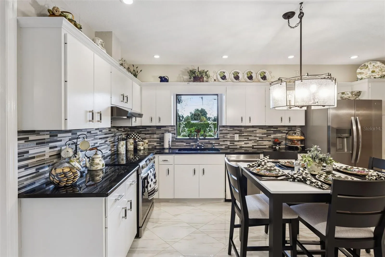 The Kitchen sink is strategically positioned beneath a picture-frame window offering wonderful views of the pool