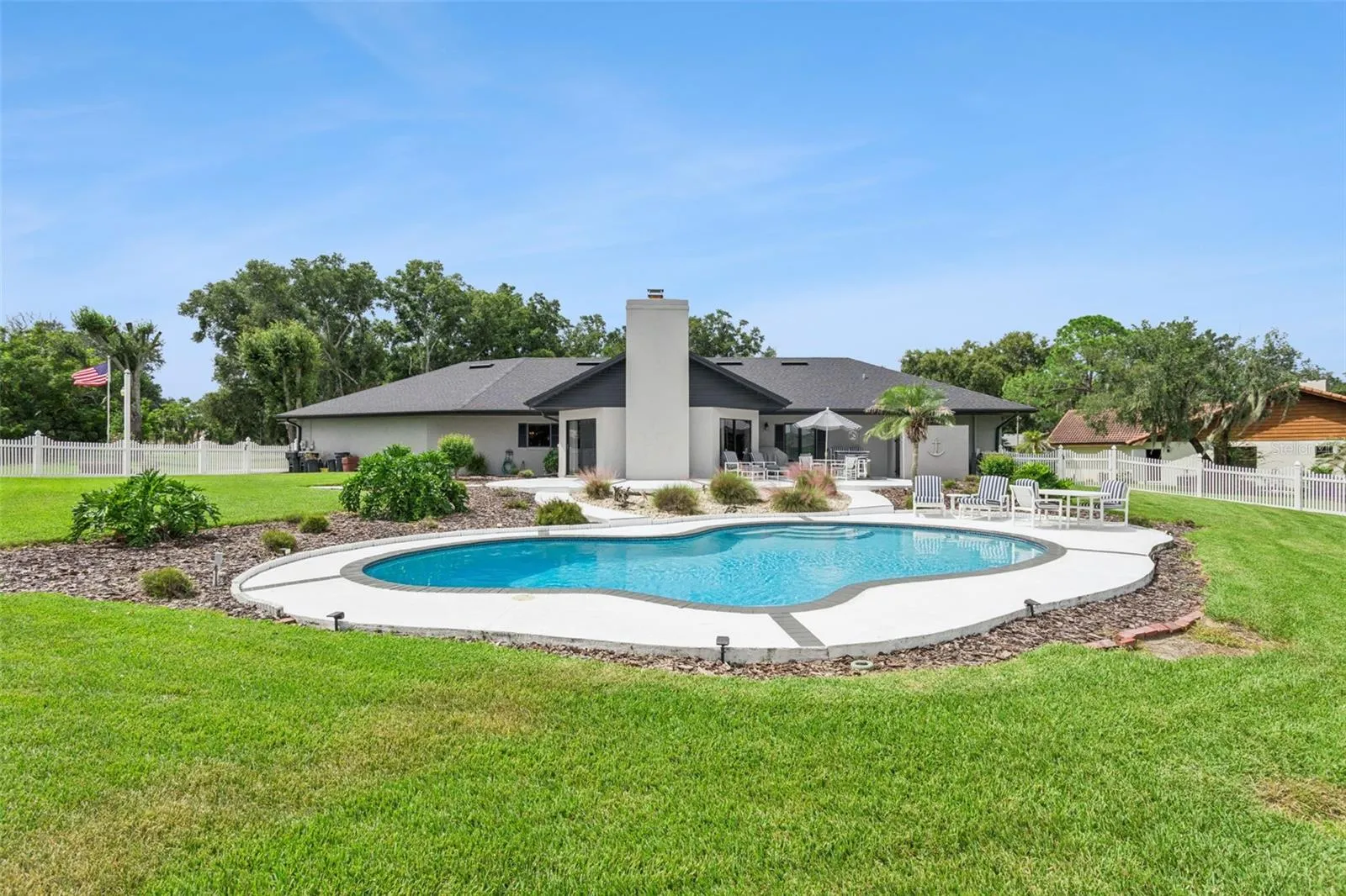 Outdoor living is truly exceptional in this meticulously landscaped backyard