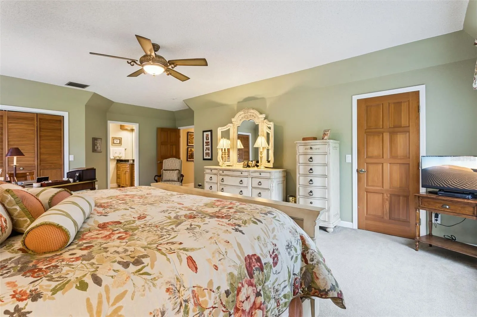 Primary Bedroom features a safe, and two closets, one of which is a walk-in closet