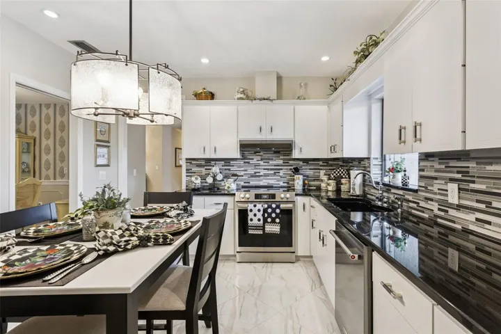 Upgraded stainless-steel appliance package includes a convection range