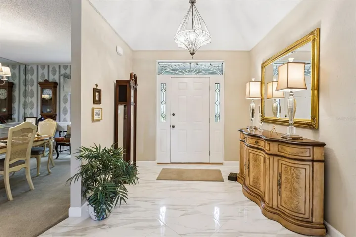 A lovely leaded-glass front door with transom window