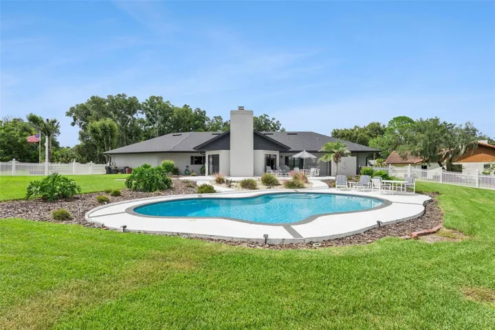 Outdoor living is truly exceptional in this meticulously landscaped backyard