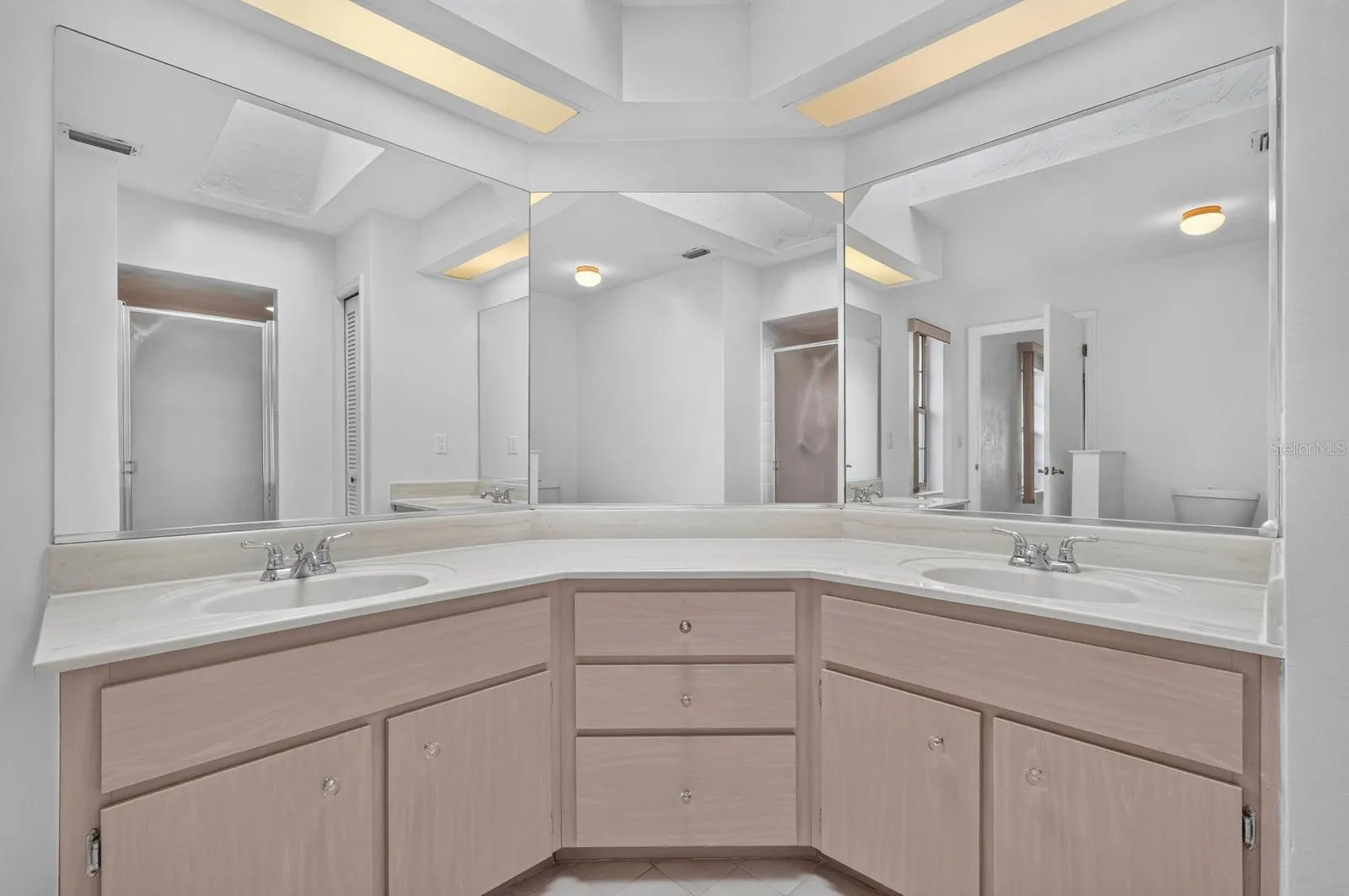 Primary bathroom has double vanity sink marble countertop