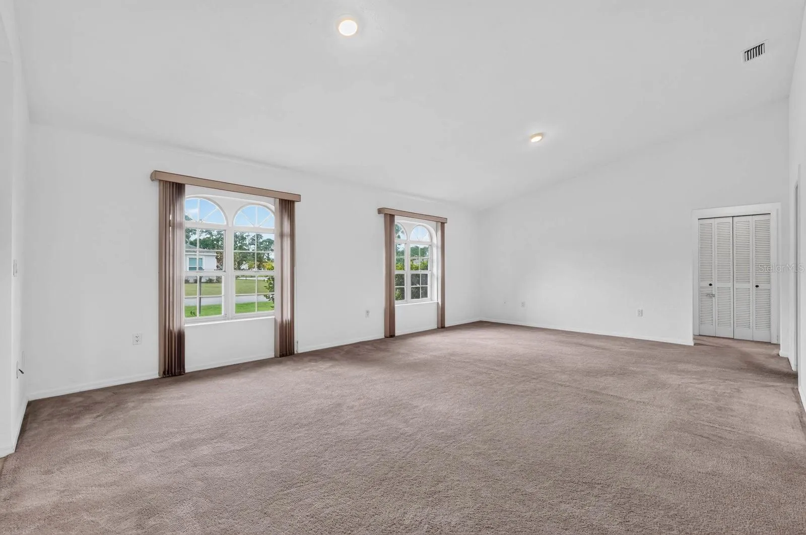 large living room with arched windows