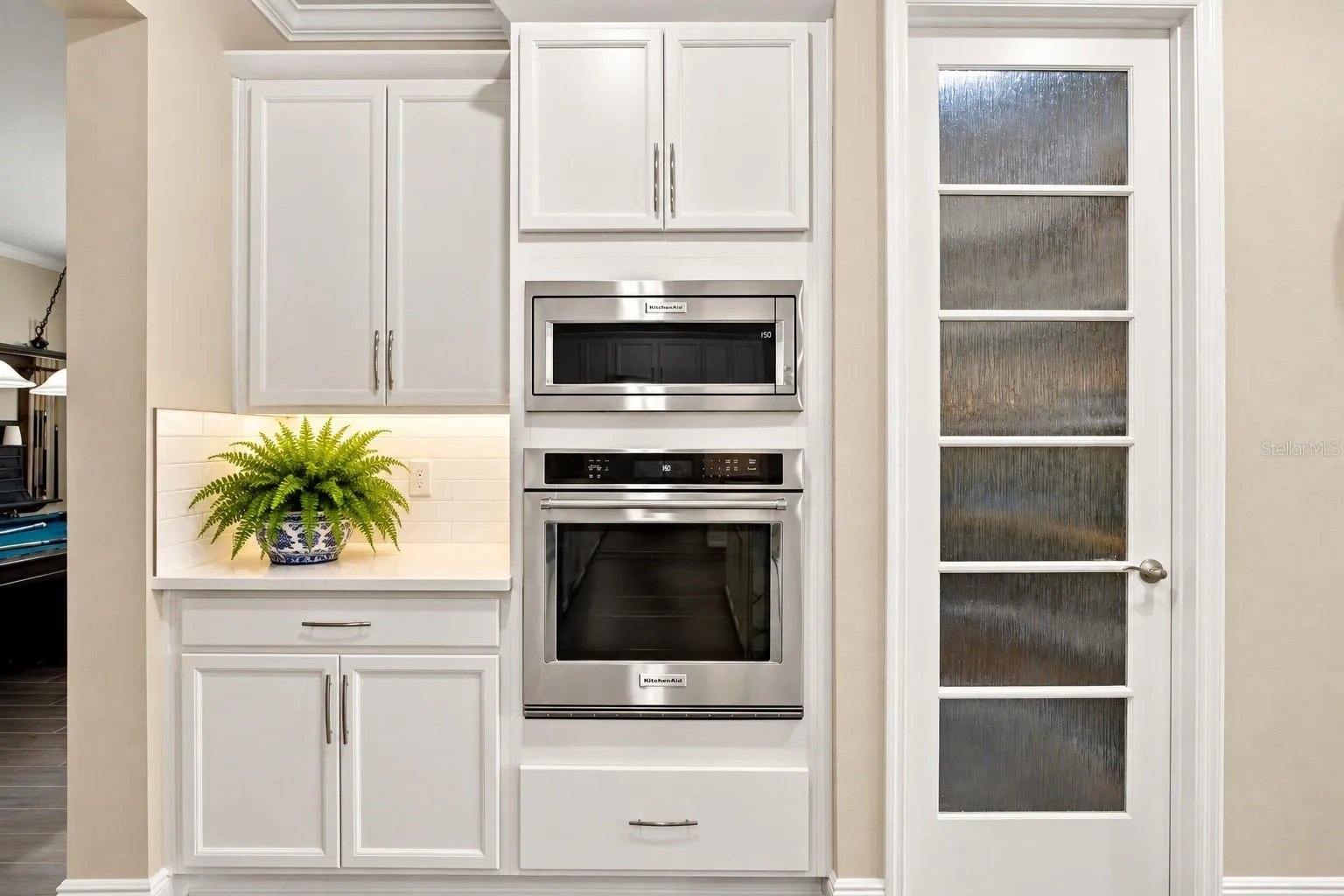 Built in Wall Oven and Microwave, extra storage to Left, Pantry to Right
