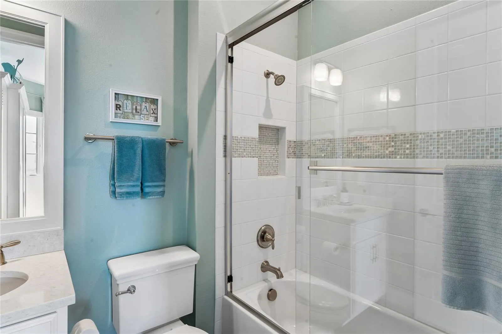 Bedroom 2 -en-suite bathroom w/ tub and glass shower doors