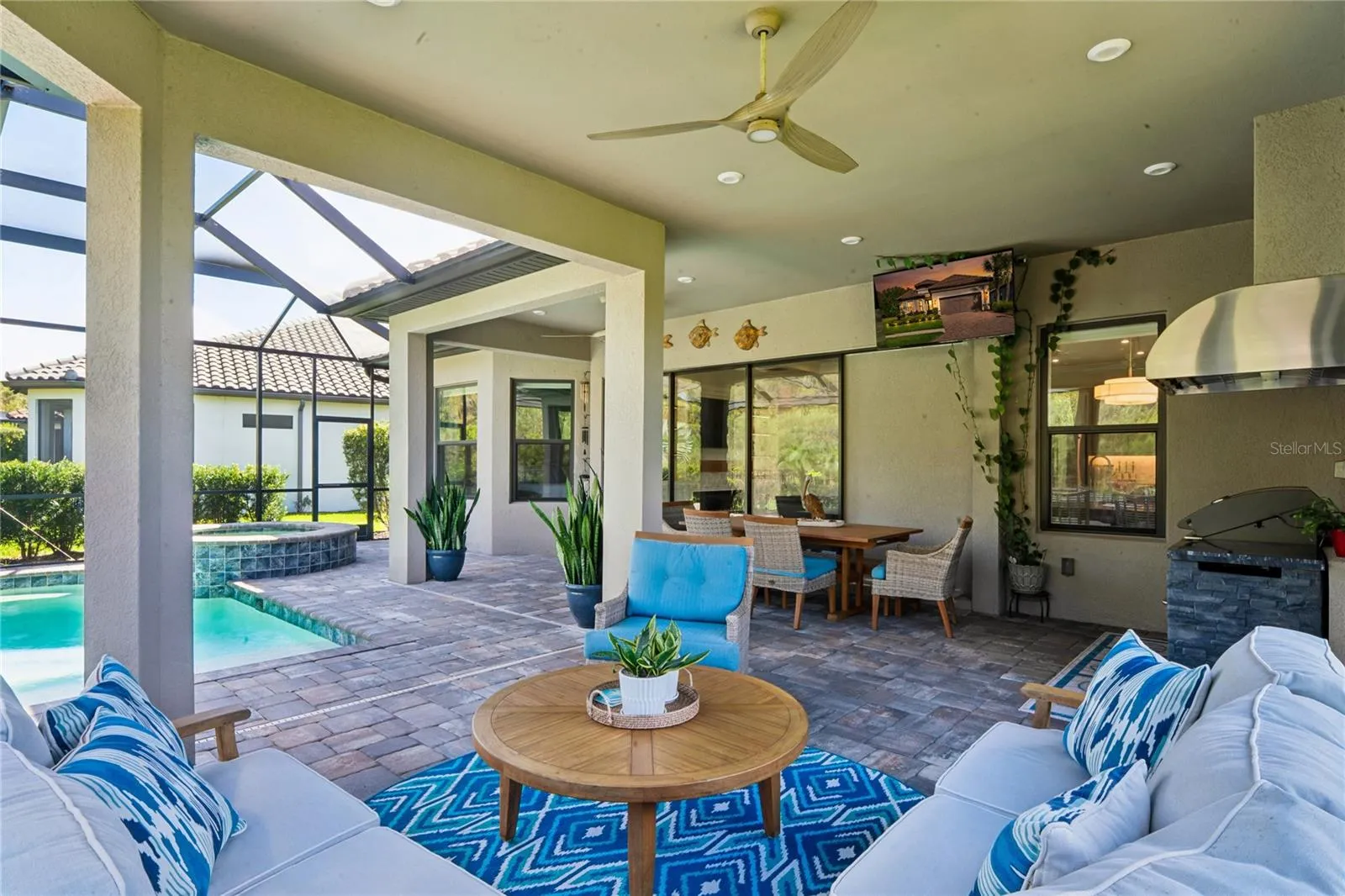 Outdoor Living space w/ Pool lanai, outdoor kitchen &amp; dining