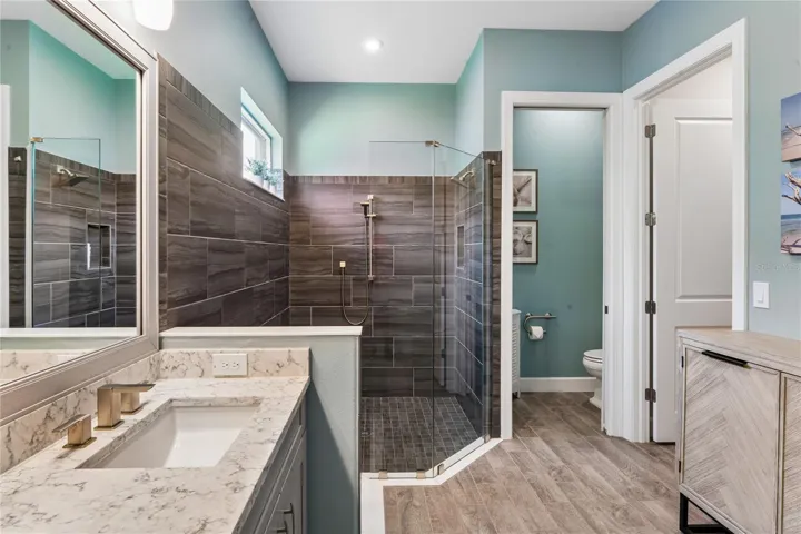 Primary bathroom w/ water room &amp; walk-in closet