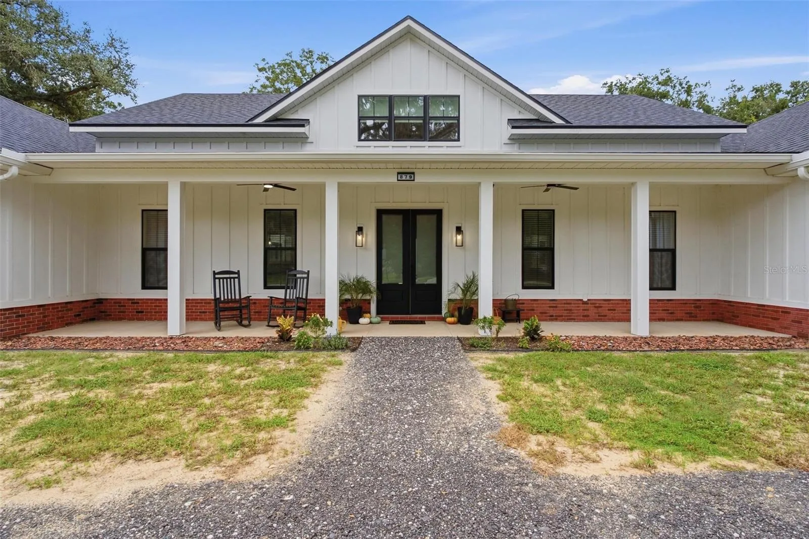 Beautiful front covered porch with double door entry