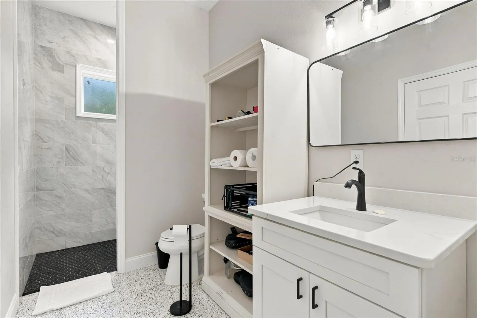 Garage full bathroom that connects to pool