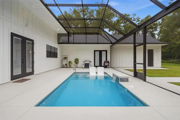 View of back porch and pool