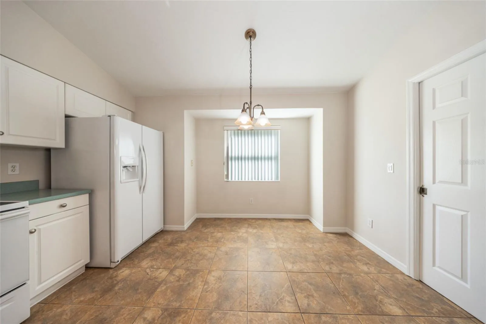 Great spot by the window for meals.  Laundry room is to the right.