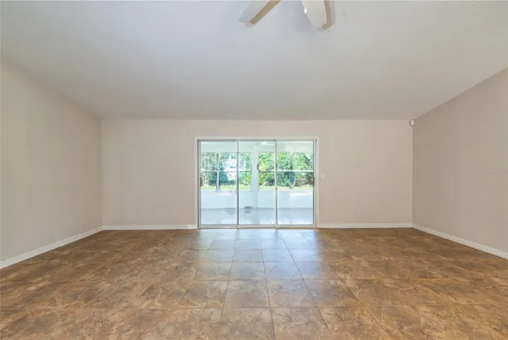 Living room looking towards the 200 sf Florida room.  Triple sliders let in so much natural light.