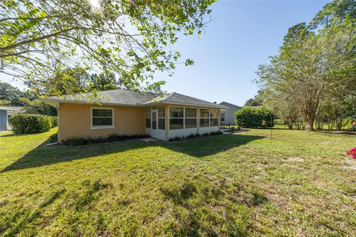 Florida room has 2 doors - one to the yard and one to the paver patio
