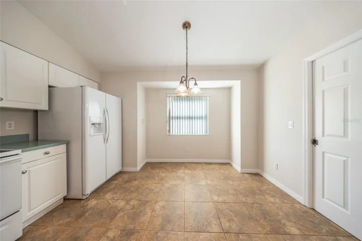Great spot by the window for meals.  Laundry room is to the right.