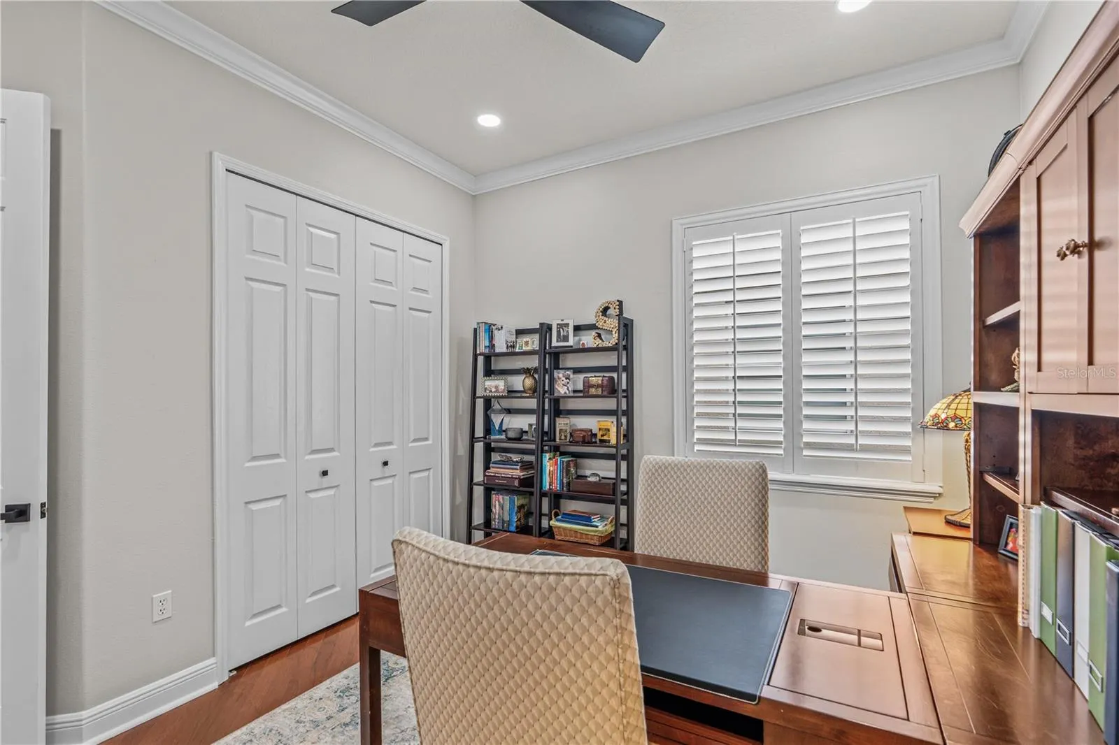 Looking toward the large window and closets; The closet has heavy-duty brackets &amp; shelving and provides lots of storage options