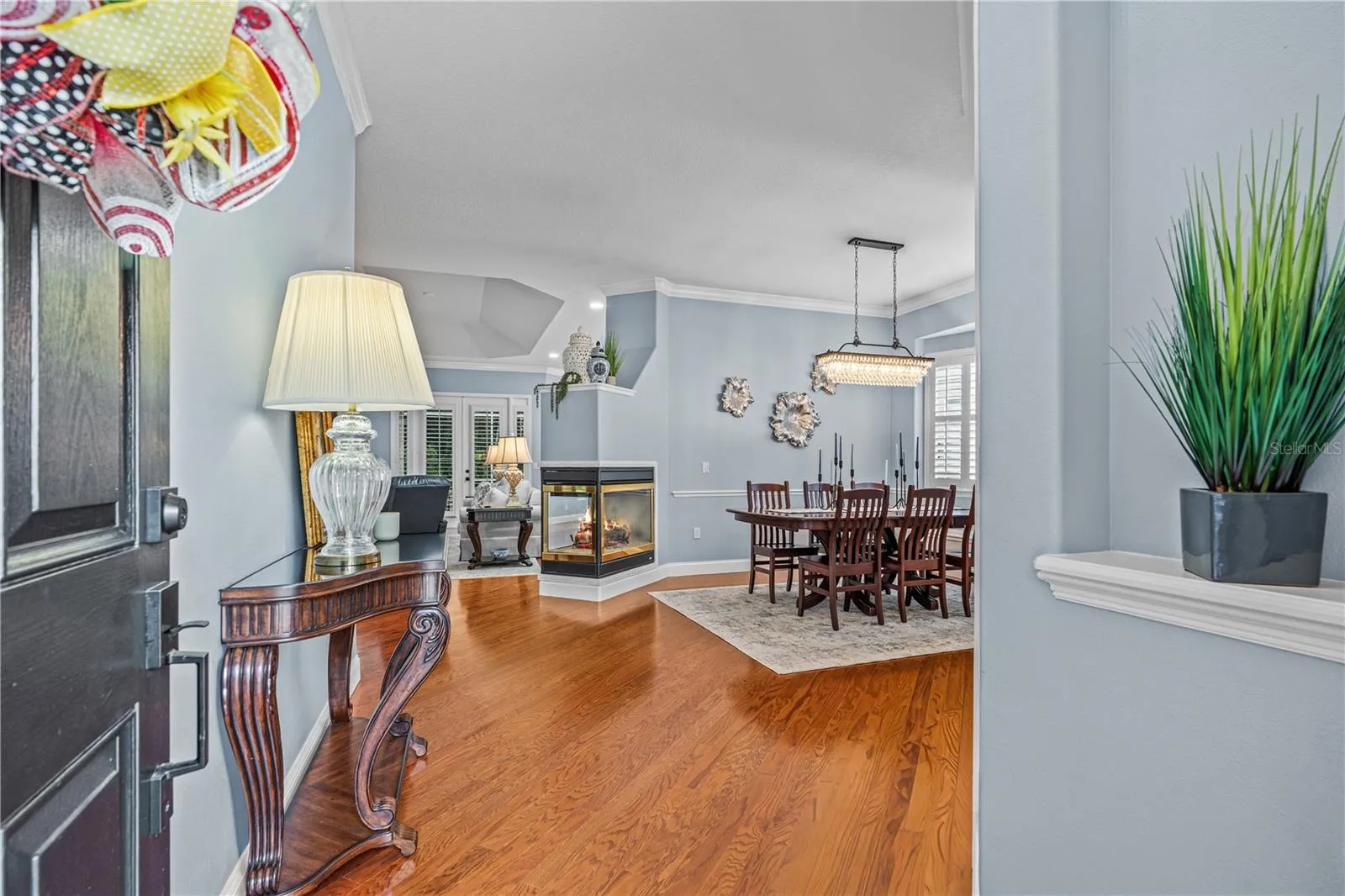 Hardwood floors, high ceilings and crown molding give an elegant first impression