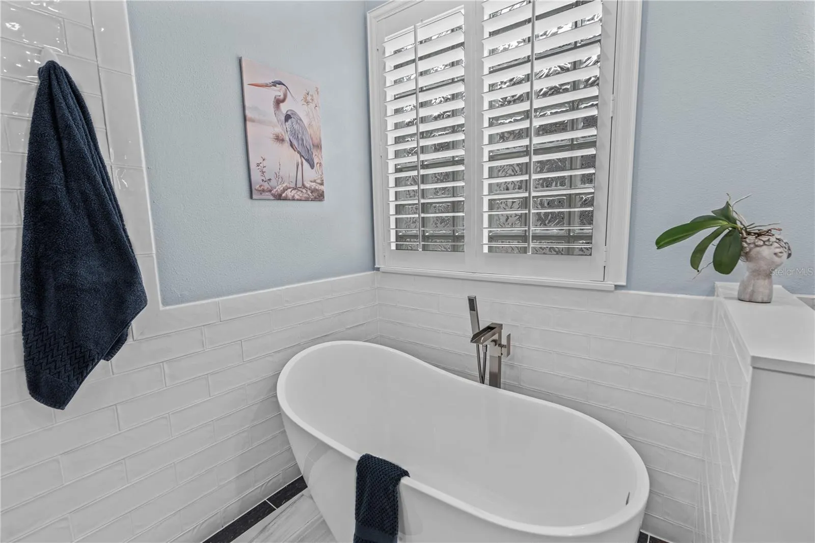 A relaxing soaker tub surrounded by elegant tile
