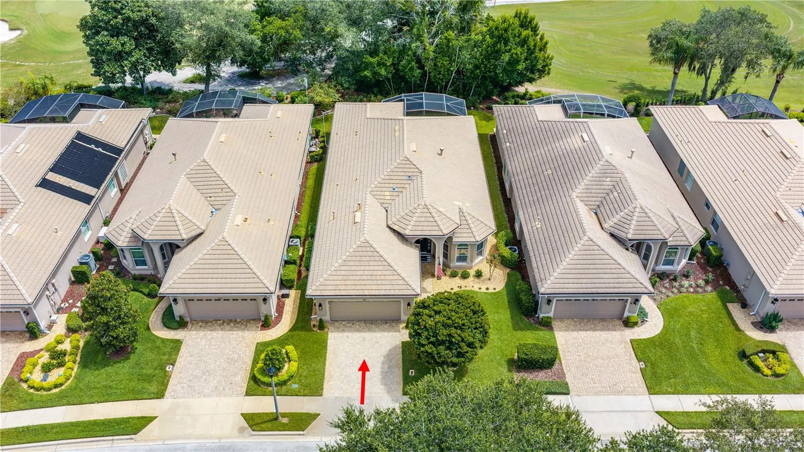 Overhead view showing tree buffer behind the home and golf course