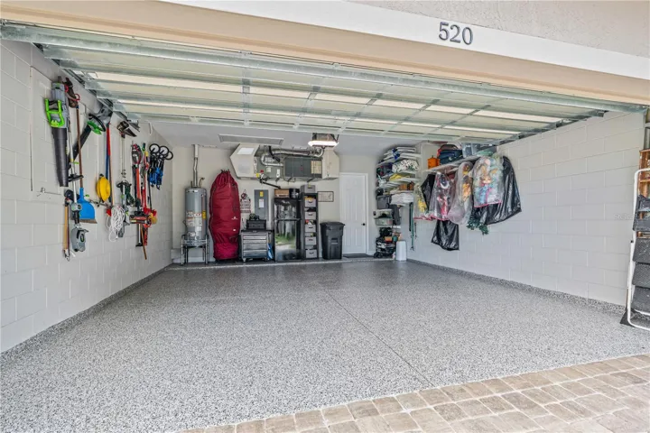 Epoxy-coated garage floor is immaculate; The "myQ" wifi-enabled garage door opener &amp; entry pad with integrated camera (not shown in this picture) convey