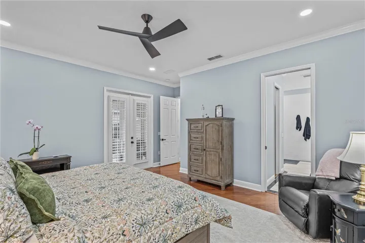 Looking toward the entrance to the primary bedroom-- and showing the French doors to the lanai