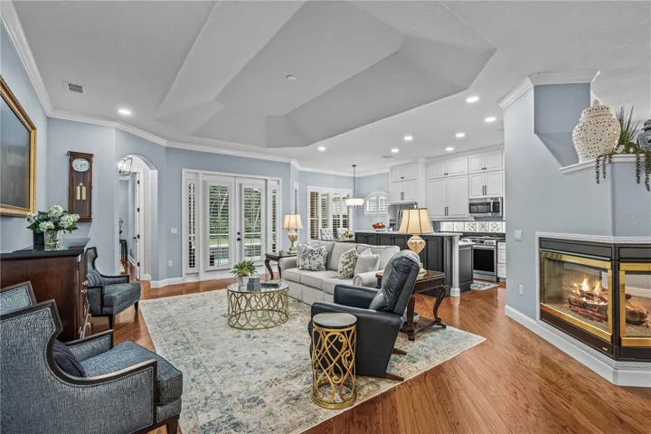 Great room which is open to the kitchen with French doors out to the lanai