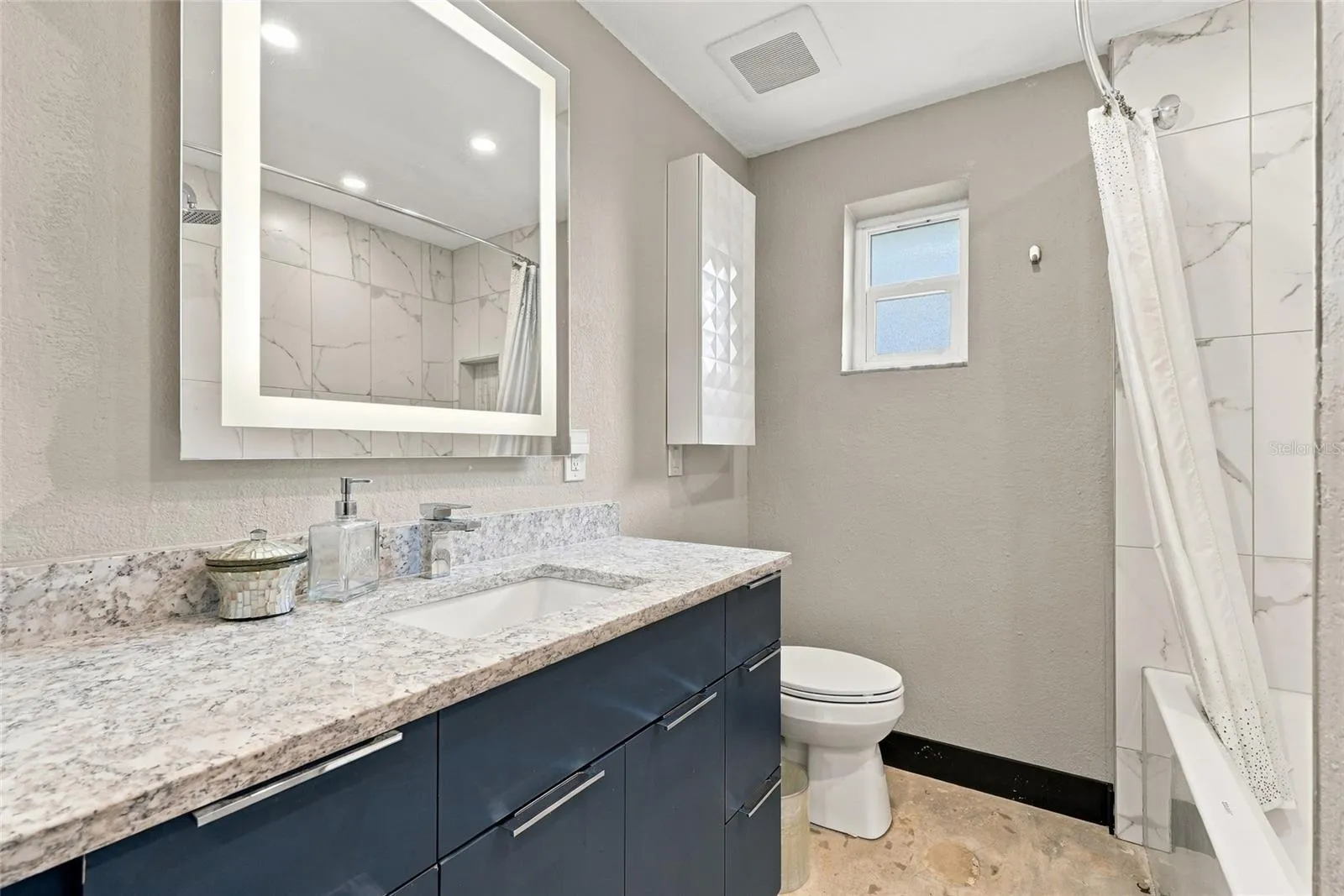 hall bathroom with soaking tub