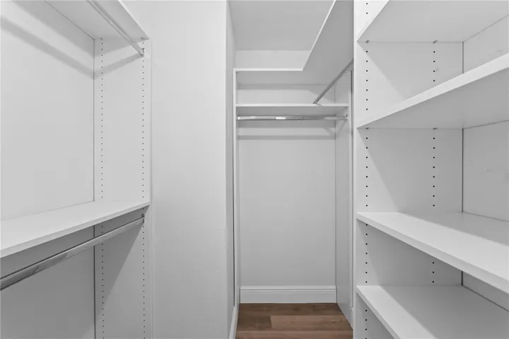 Primary Bedroom Walk-in closet with Custom Built-ins