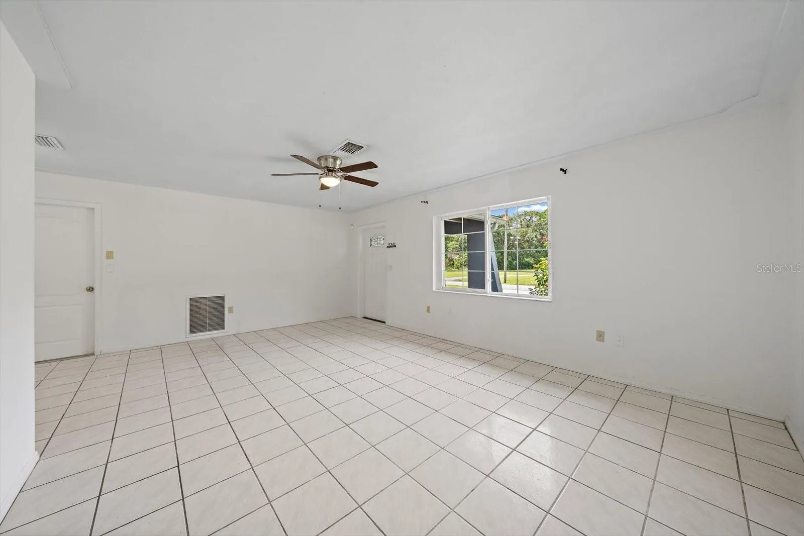 newer, side-slide window, the left-hand door leads to garage