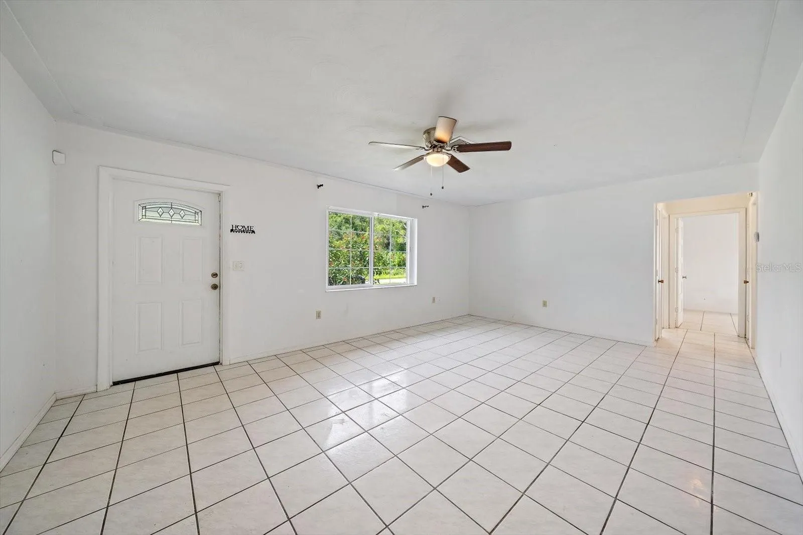 Tile throughout. Ceiling fans, several newer windows windows.