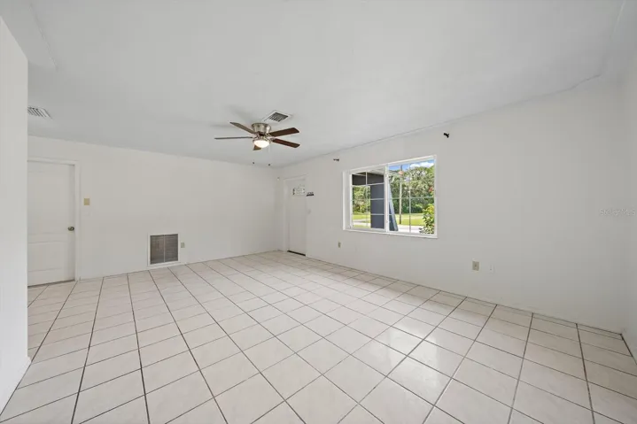 newer, side-slide window, the left-hand door leads to garage