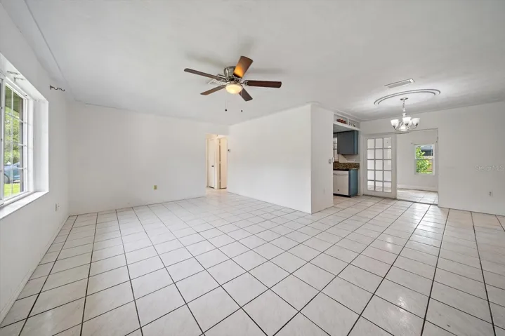 Living/ Dining Room open plan with French doors to Bonus Room