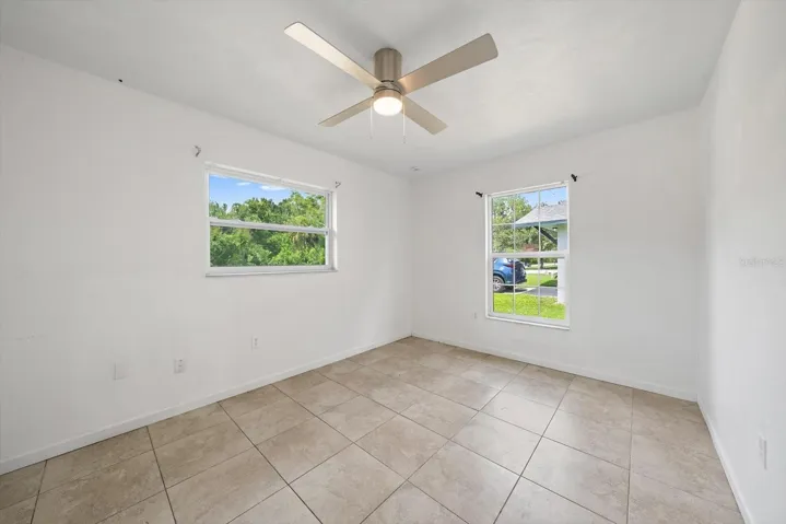 2nd bedroom= good-looking tile, updated ceiling fan, lots of natural light