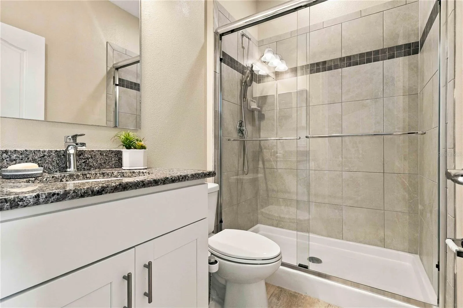 Fourth bedroom offering privacy and a private bath