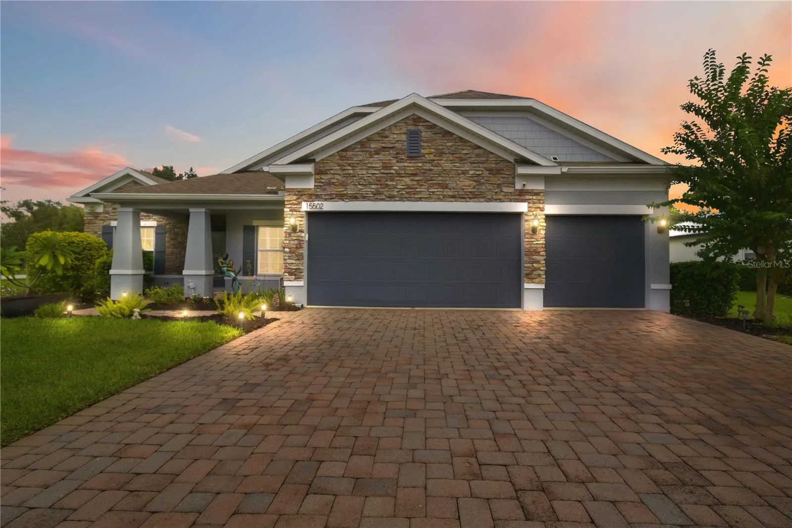 Twilight front exterior with welcoming curb appeal.