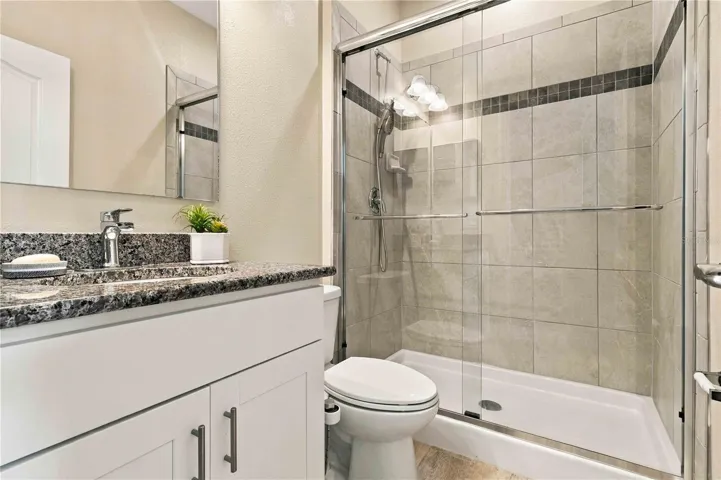 Fourth bedroom offering privacy and a private bath